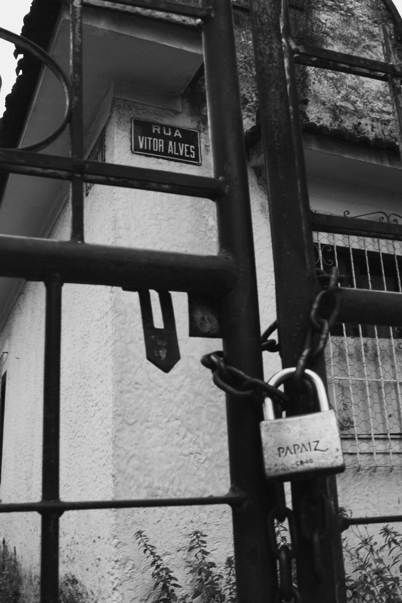 Residential gate secured with a padlock