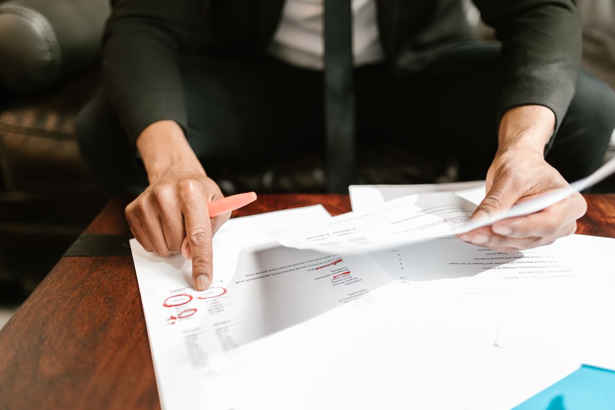 Financial account documents being reviewed