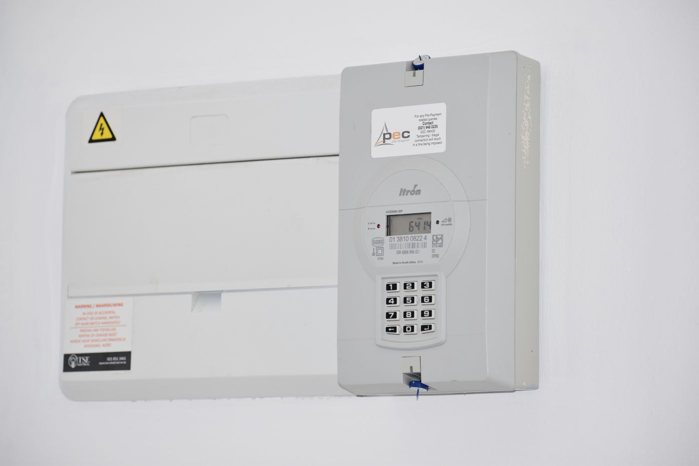 Electricity meter on a residential exterior wall in South Africa